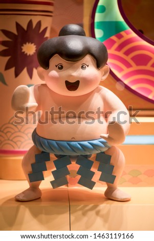 Japanese Sumo Statue, a traditional cute young Sumo practitioner statue of one of the world's oldest martial arts