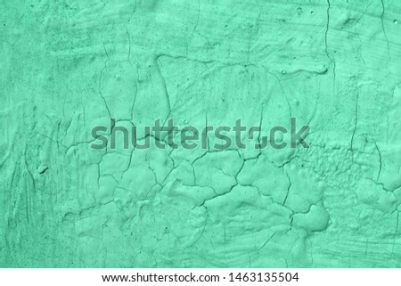 cute teal, sea-green old brushed broken stucco texture - abstract photo background