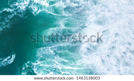 Aerial view to tropical beach and wave blue ocean at New Zealand. Aerial drone shot of turquoise sea water at the beach - space for text. 