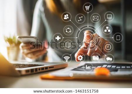 Businessman working with smart phone and laptop and digital tablet computer in  office with digital marketing media  in virtual icon
