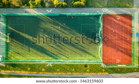 Sports field with footballers playing, aerial view of Poland