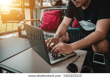 Freelance content creator working with content on the laptop in the coffee shop