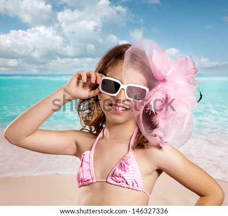 Children girl in tropical turquoise beach vacations with pink fashion style vintage color