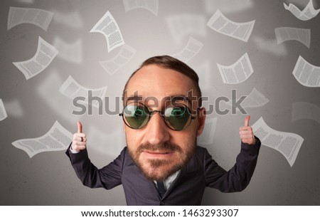 Big head on small body with flying documents around