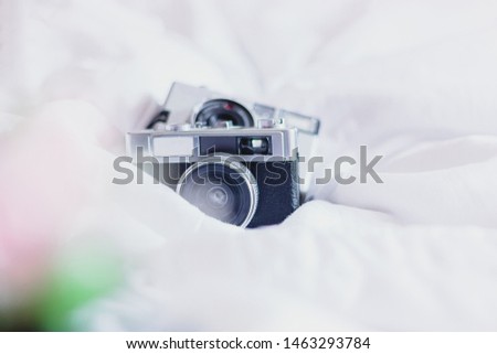 Two old cameras on white background