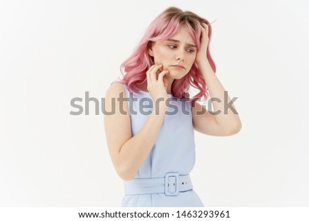 woman with pink hair on a light background
