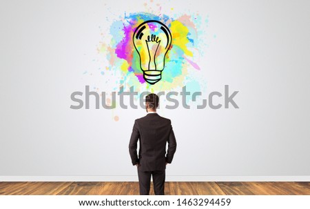 Businessman looking to a wall with new idea concept