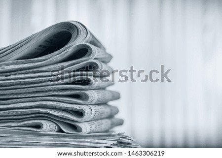 Newspapers folded stack, the concept of world news