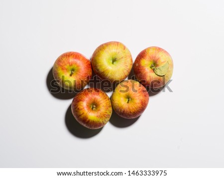 
Polish ecological apples on a white background in the sunlight. Photographing with a medium format camera with a resolution of 50 MP