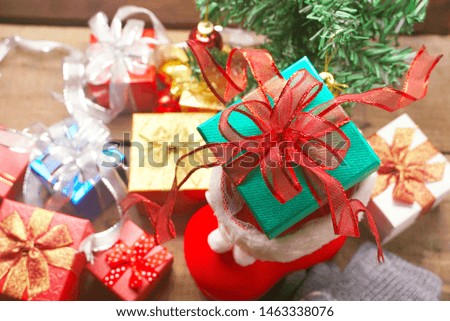 Topview green gift box in Santa Claus shoes decorate for celebrate christmas party night.