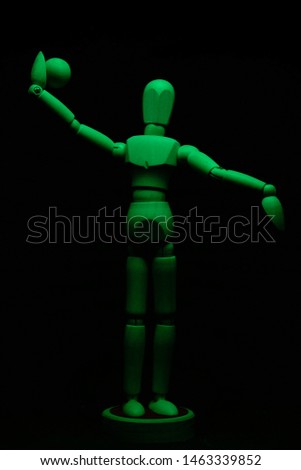 Lighted figurine in the darkness