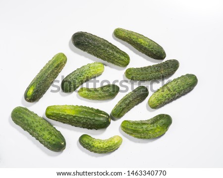 Polish organic cucumbers on a white background.
Photographing with a medium format camera with a resolution of 50 MP