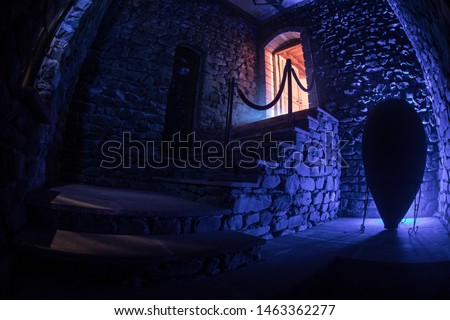 Inside of old creepy abandoned mansion. Staircase and colonnade. Dark castle stairs to the basement. Spooky dungeon stone stairs in old castle. Horror Halloween background