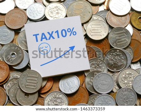 The consumption tax in Japan will be increasing by 2% in October 2019 to be 10%. The photo of message card with 10% printed with the bakgroun of japanese yen coins. 