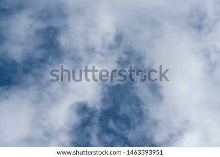 beautiful background of clouds, clearly visible lines of white clouds and blue sky, the top is a sunbeam