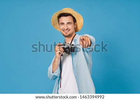 handsome man in blue shirt camera travel lifestyle tourism