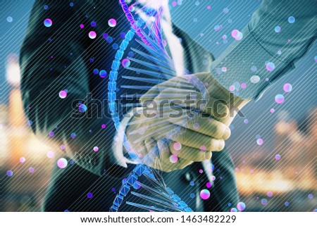 Multi exposure of DNA drawing hologram on city view background with handshake. Concept of education