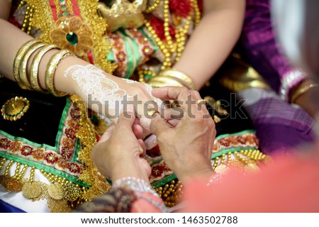 put on a wedding ring Royalty-Free Stock Photo #1463502788