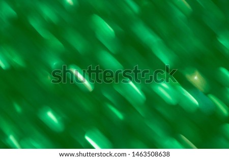 background abstract dynamic green light and stripes moving fast. Trending wallpaper on the phone screen.