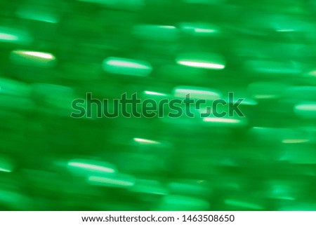background abstract dynamic green light and stripes moving fast. Trending wallpaper on the phone screen.