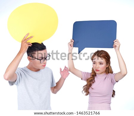 Asian beautiful attractive young girl and handsome boy holding speech bubble concept isolated on white background