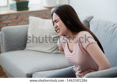 Closeup picture of a woman with 
stomachache, menstrual cramps torture.
 Royalty-Free Stock Photo #1463581286