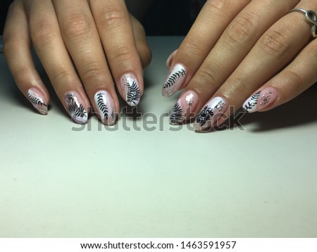 fashionable light manicure with white silver and