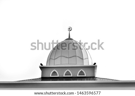 Muslim mosque ( dome ) , moon and star Islamic symbol in clear sky in black and white photography.