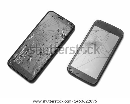 Two broken smartphones on a white background. Cracked display. Gadgets for repair.