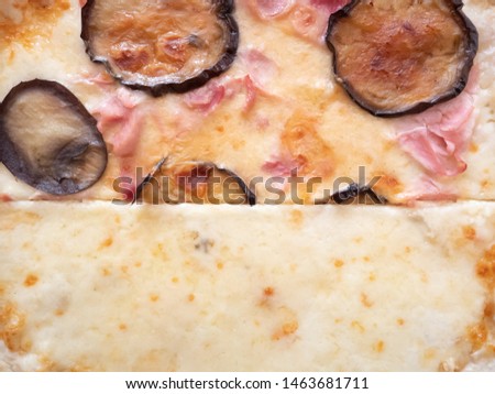 Close up of an Italian pizza with fried eggplant and cheese. Traditional dish
