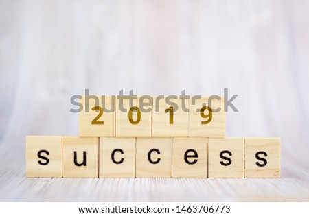 Success word from wooden blocks on desk. Concept of successful in business