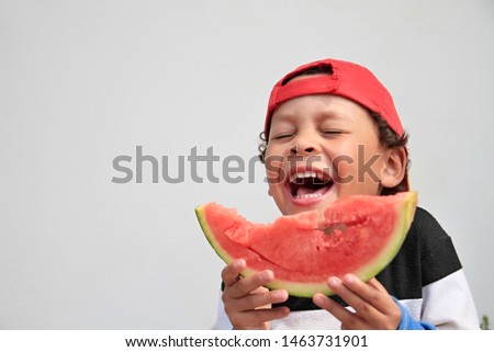 little boy eating sweet red watermelon stock image and stock photo