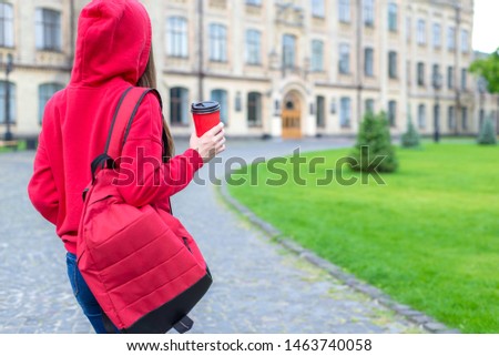 Back behind rear view photo of satisfied nice hipster person enjoying tea going to the building
