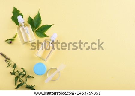 Beautiful layout of cosmetic products on yellow background . Natural cosmetic.place for text . top view . Natural beauty product concept.