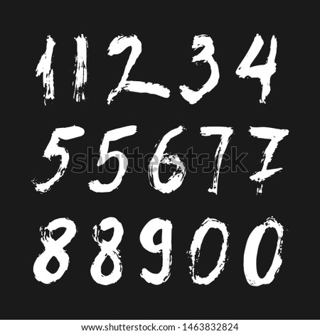 Set of calligraphic numbers painted by white  brush on isolated black background. Lettering for your design. Vector illustration