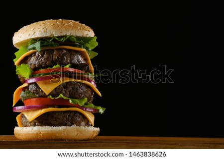 big burger on a wooden board