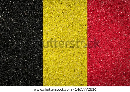 National flag of Belgium on a stone background.The concept of national pride and symbol of the country.