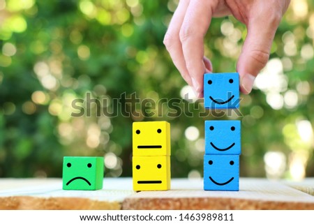 Business concept photo of chosen person among others.a smiling face stands out from the crowd