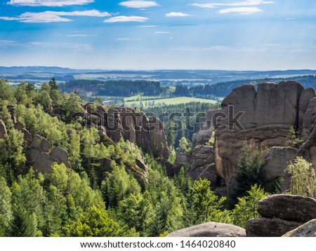 The view of natural sand rocky wall from the Rocky Theatre outlook (vyhlidka Skalni divadlo) with forest in the background in Broumovske Steny national park. Czech Republic Royalty-Free Stock Photo #1464020840