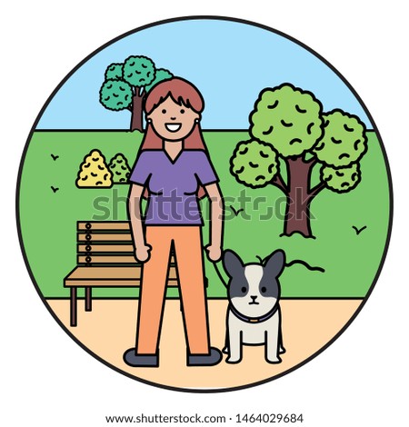 young woman with little dog in the park