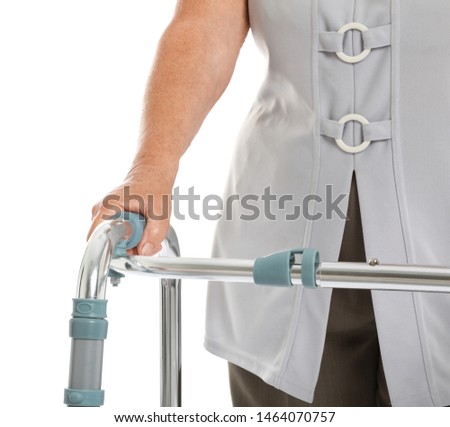 Elderly woman using walking frame isolated on white, closeup