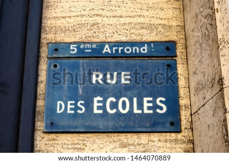 French text: Rue des Ecoles.
English translation: School Street.
Blue and white street name plate. Paris, France.