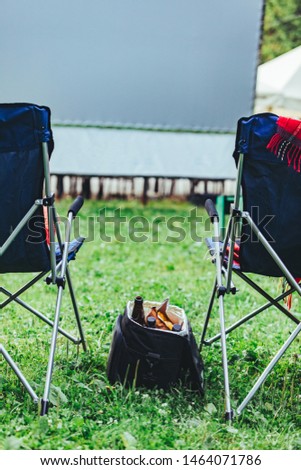 open air cinema concept folding chairs in front of big white movie screen