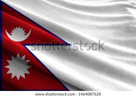 Realistic flag of Nepal on the wavy surface of fabric