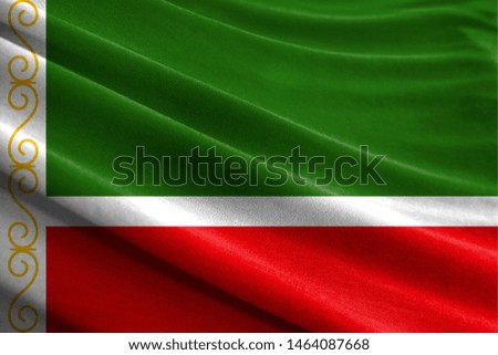 Realistic flag of Chechen Republic on the wavy surface of fabric