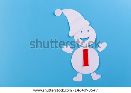 Paper art style of snowman on blue background