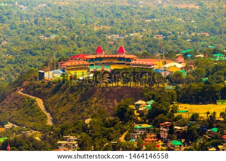 Himachal Pradesh Cricket Association Stadium is a picturesque cricket stadium located in the city of Dharamshala District in Himachal Pradesh, India. Aerial View of Dharamshala from Mcleodganj Hills. Royalty-Free Stock Photo #1464146558