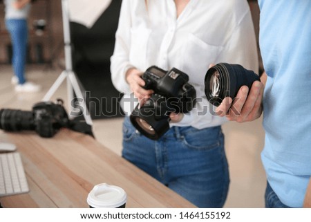 Professional photographers in modern studio