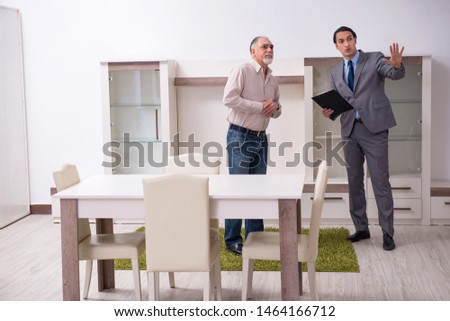 Male real estate agent and male client in the apartment 