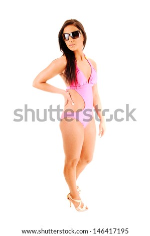 A lull lengths picture of a teen girl is a bikini with her long brunette hair for white background, with sunglasses on. 